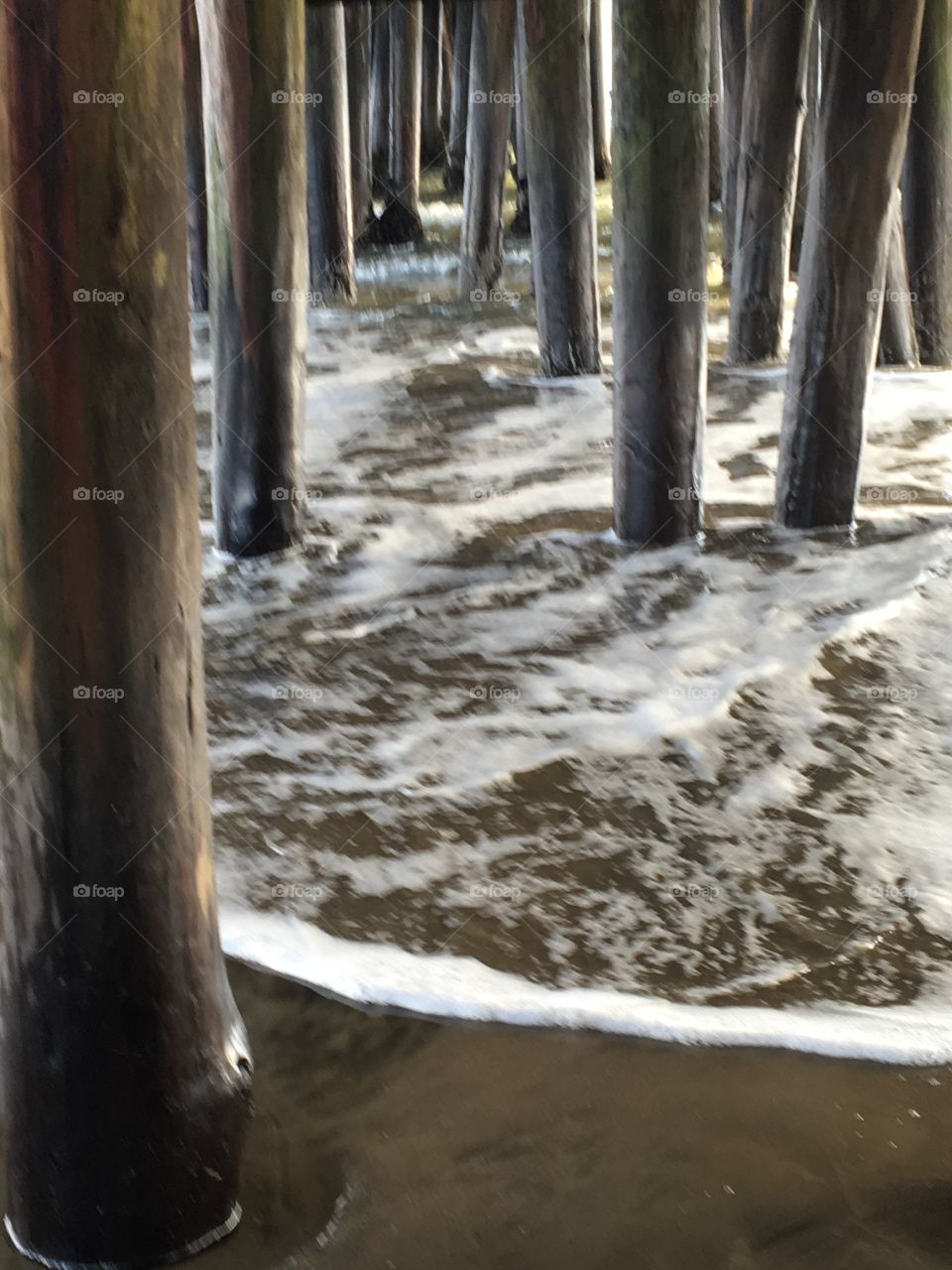 Under the Boardwalk during high tide 