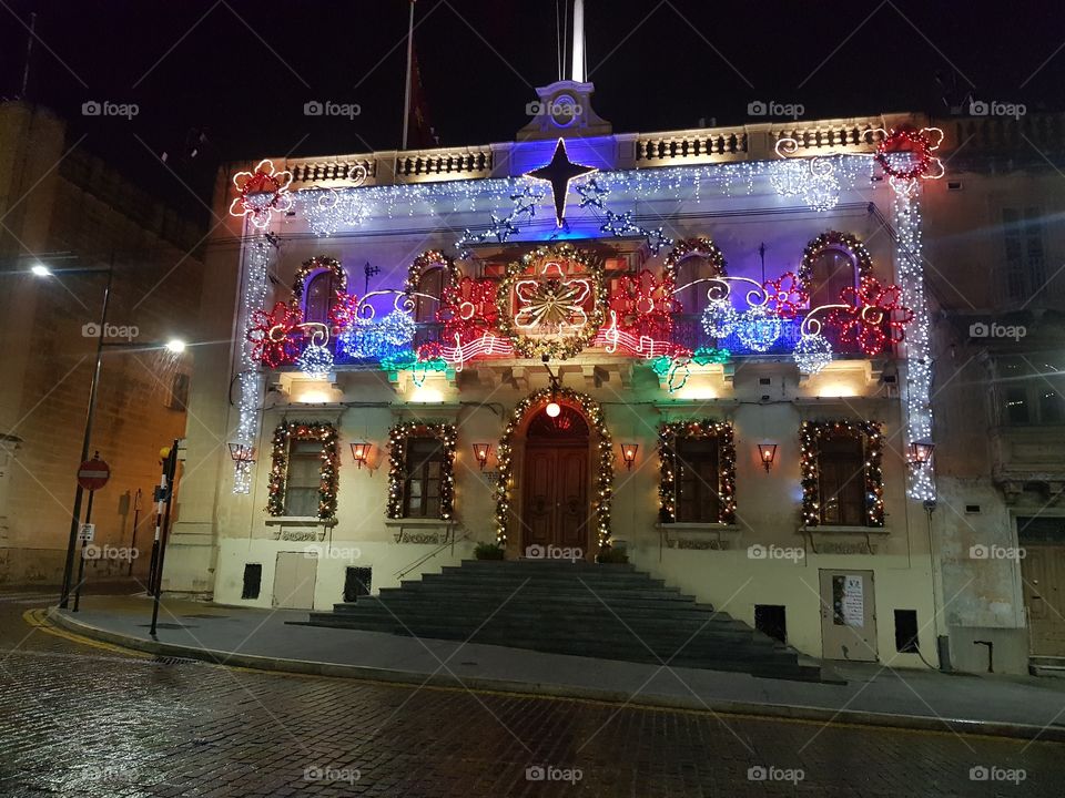 building decorated with Christmas lights