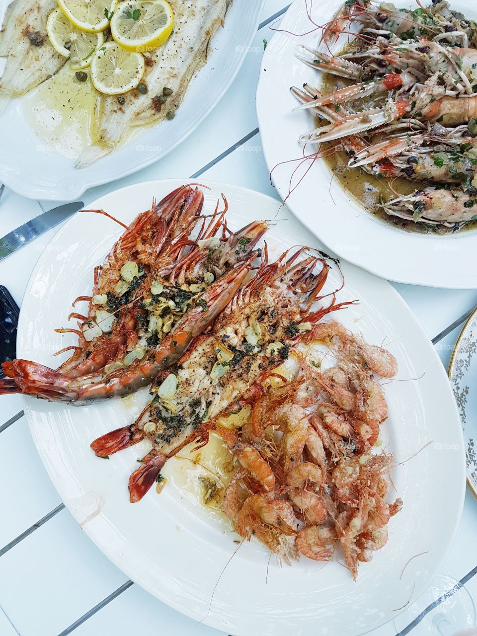a seafood feast laid out on a white table