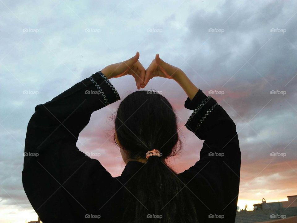 Beautiful heart made of human child s hand.