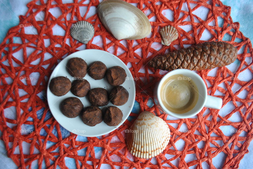 High angle view of coffee with seashell