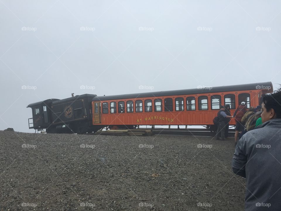 Cog tail train at the cloudy summit of Mt. Washington in New Hampshire.