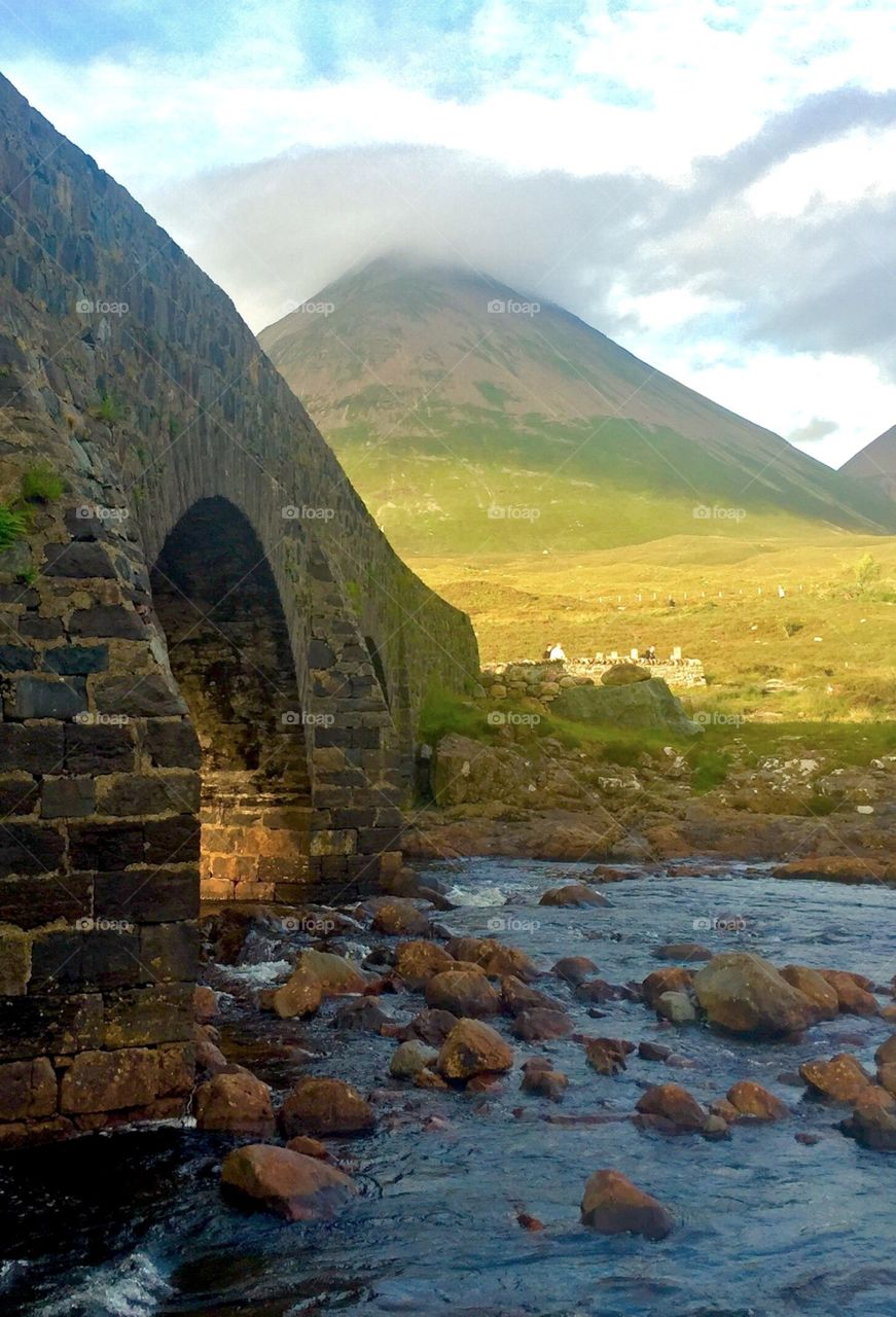 Rock Bridge over pure water in Carbost creek , Scotland
