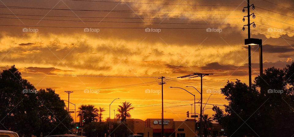 sun setting with a beautiful orange sky