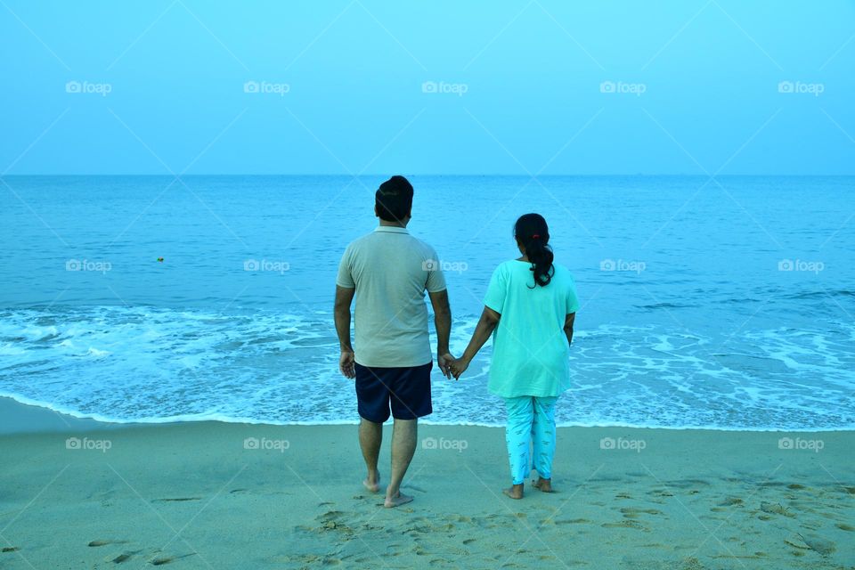 Beautiful pair enjoying in sea shore