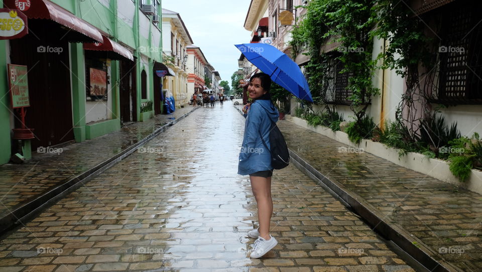 Woman with an umbrella under the rain