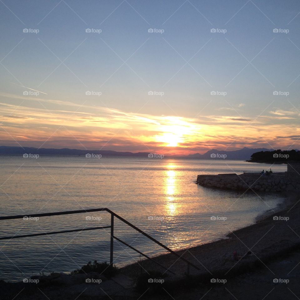Dramatic sky reflected on sea