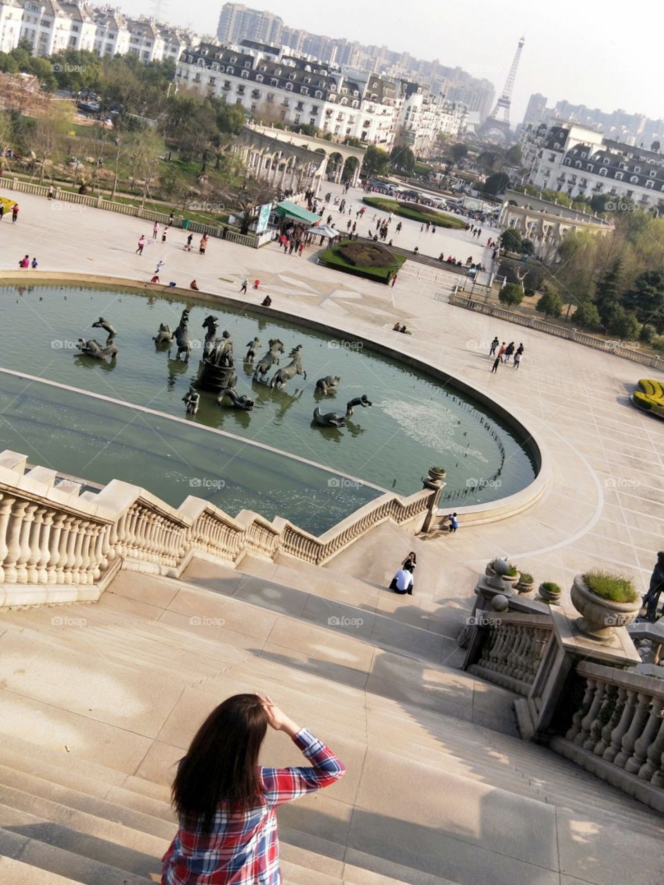 Faux eiffel tower in Hangzhou, China
The beautiful young lady thinks, as she takes in the beautiful scenery.