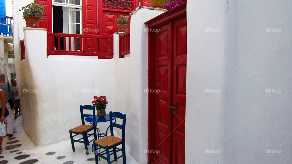 greek island doors and chairs. on mykonos tight white lane ways