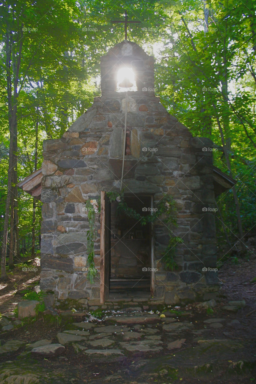 Sun shining through church steeple