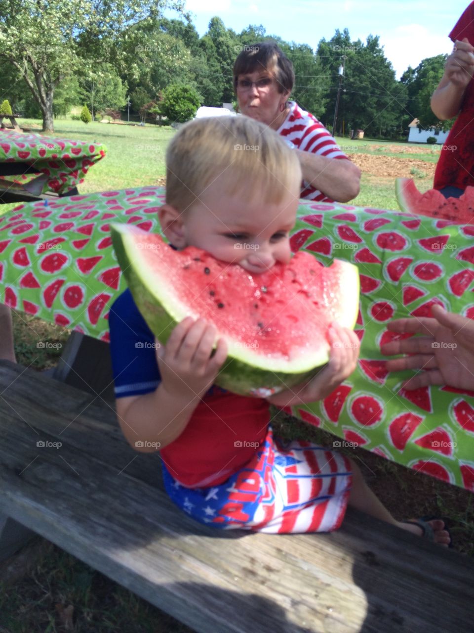 Cute boy eating watermelon