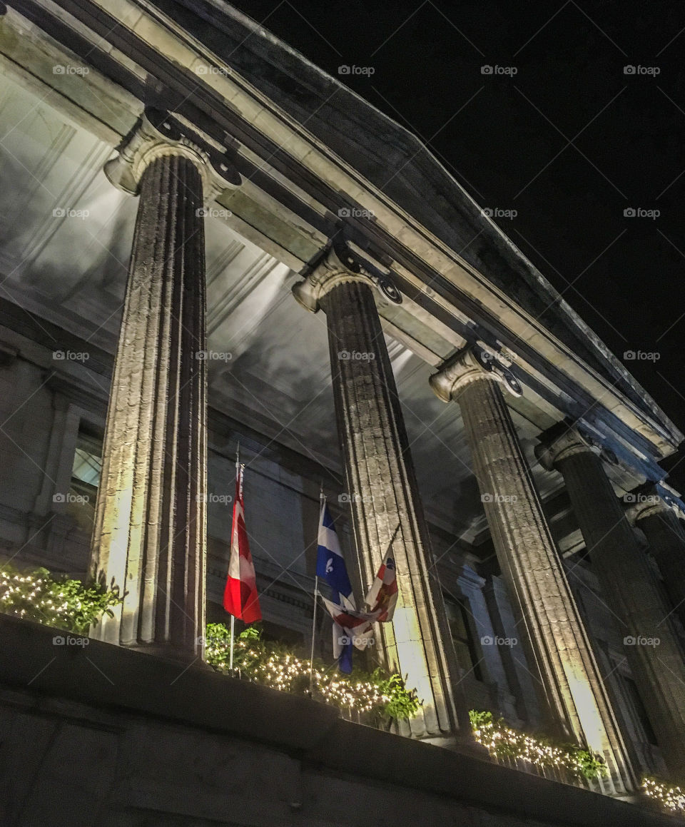 A columned building in Old Town Montreal.  It was beautifully lit up. 