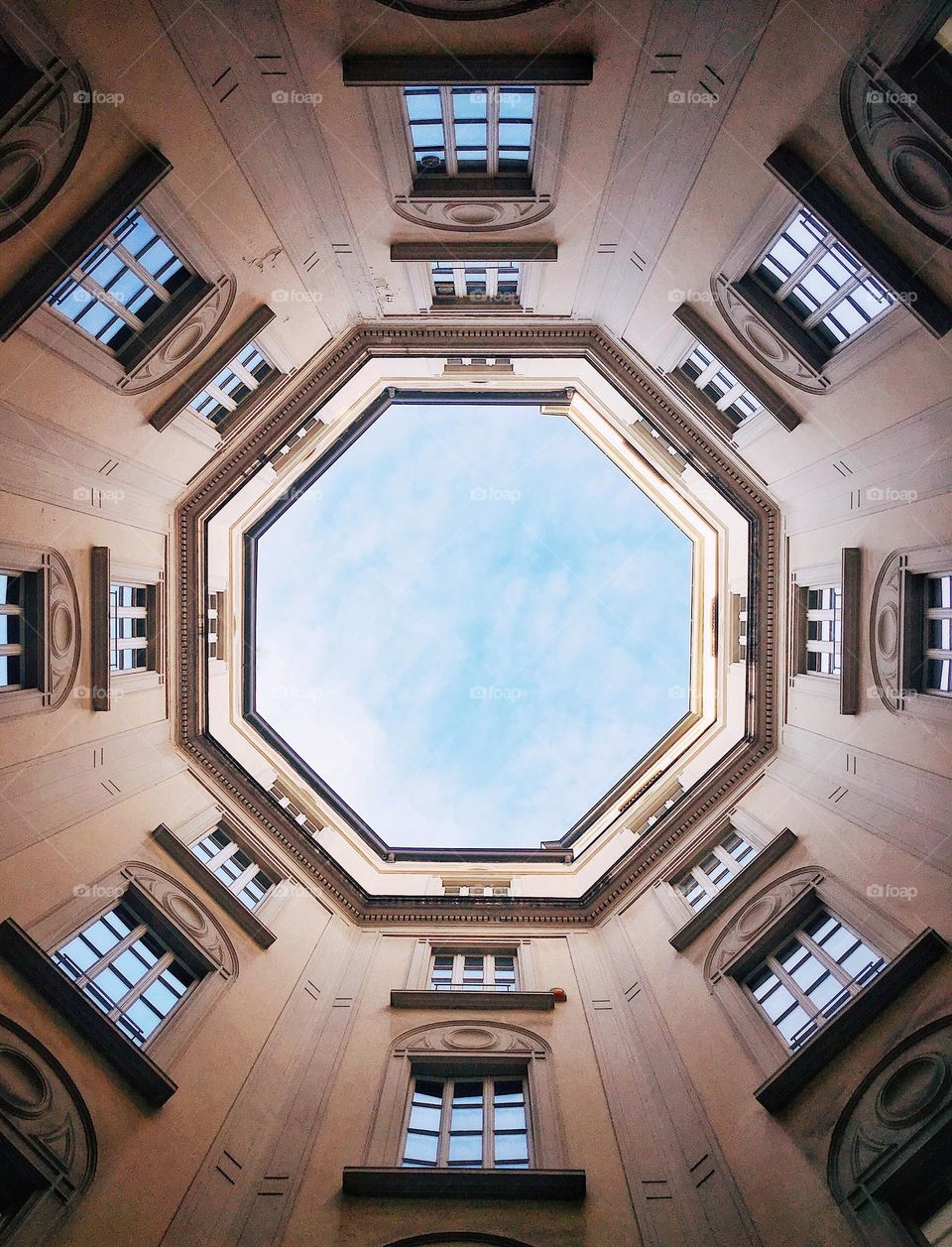 Bottom view of historic geometric building in Milan