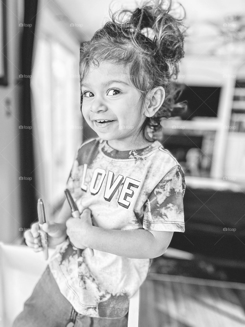 Black and white portrait of a happy toddler, happiness as an emotion, the emotion of happiness, cute toddler smiling, toddler showing happiness, making crafts with toddlers, kids and crafts, black and white toddler portrait