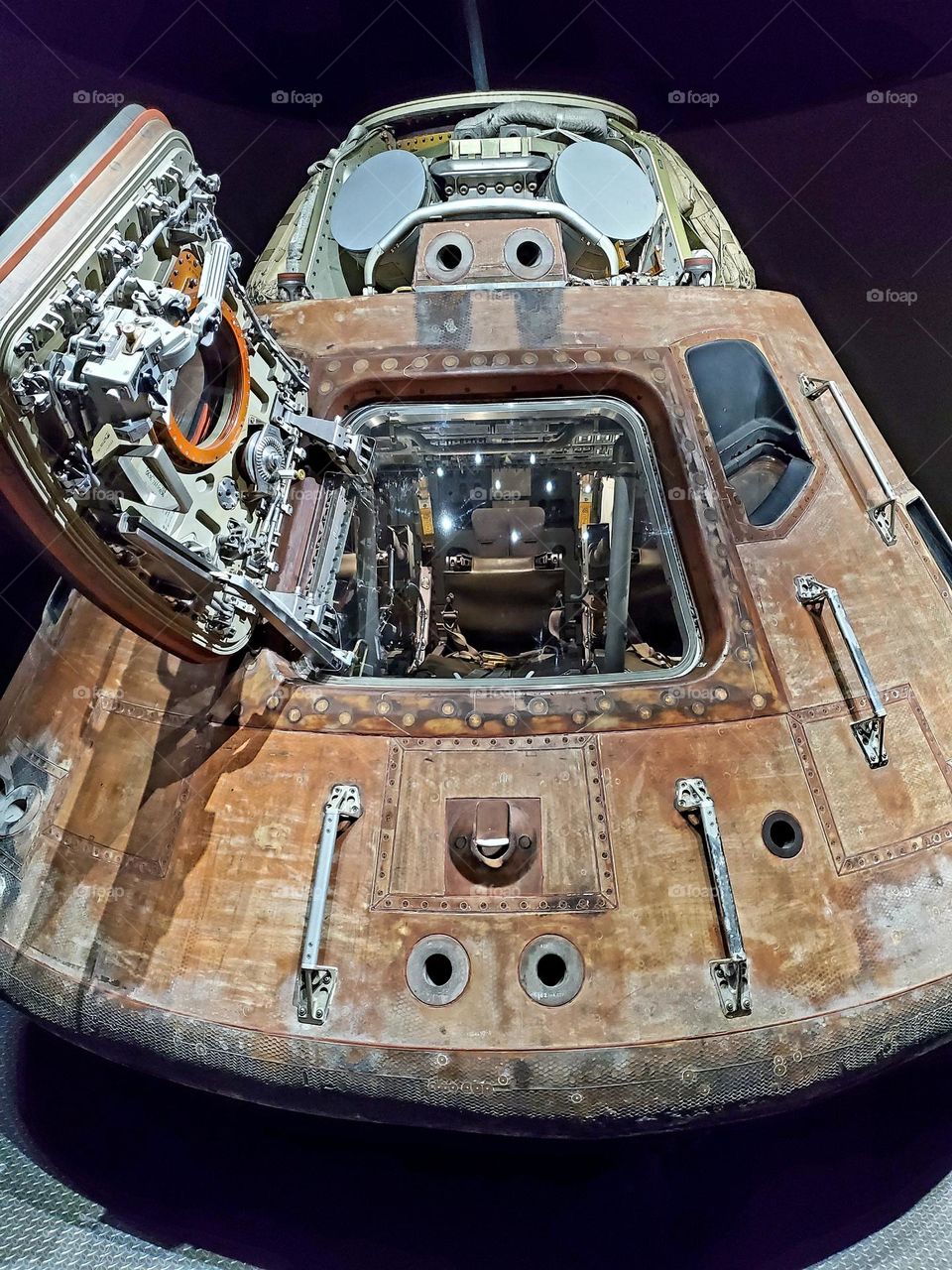 A space capsule shows the burn marks from reentry
