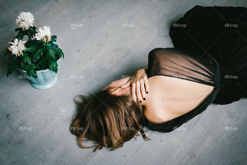 Elevated view of woman lying on floor