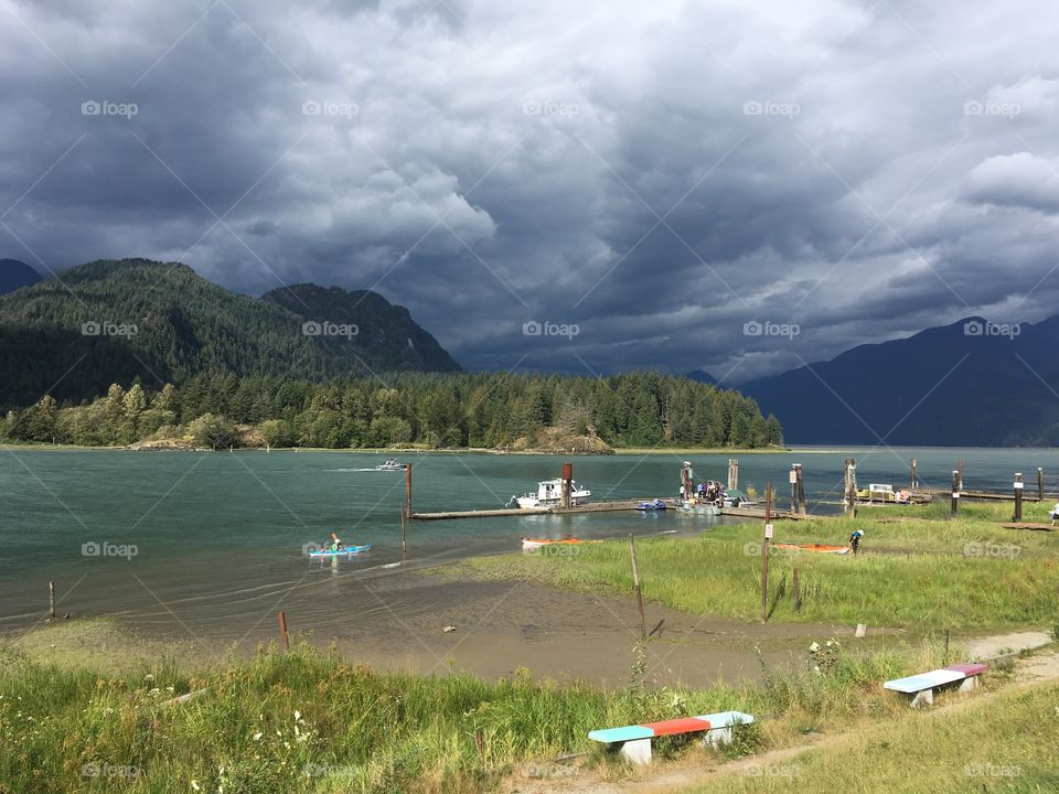 Hanging at the lake in beautiful British Columbia Canada . Calm before the storm on a hot summer day. 
