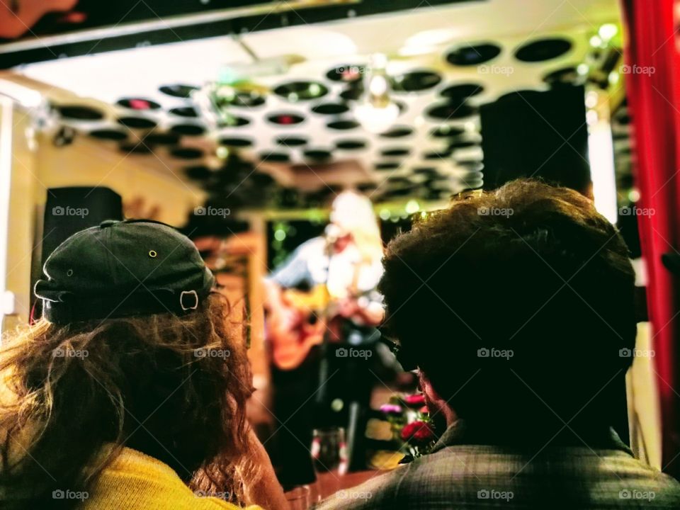 How about a cool singer-songwriter? I've tried to capture the way that a good musician or band can hold an audience, make them hang on every word.
