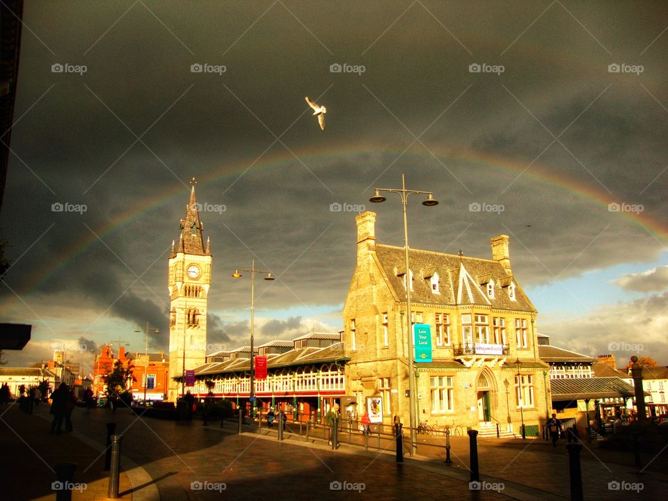 Black sky above then sunshine and showers resulted in a magnificent rainbow in town whilst shopping then to top it all a pigeon decided to head for the skies just as I snapped my shot ... 🌈