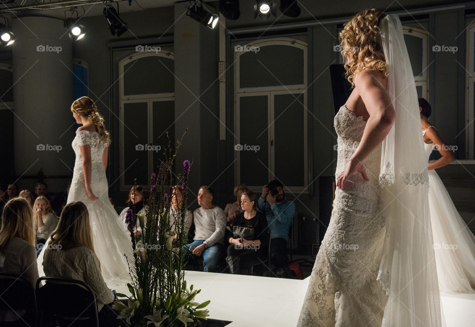 Fashion show at a wedding fair. Here are the latest dresses and clothes for both bride and groom.