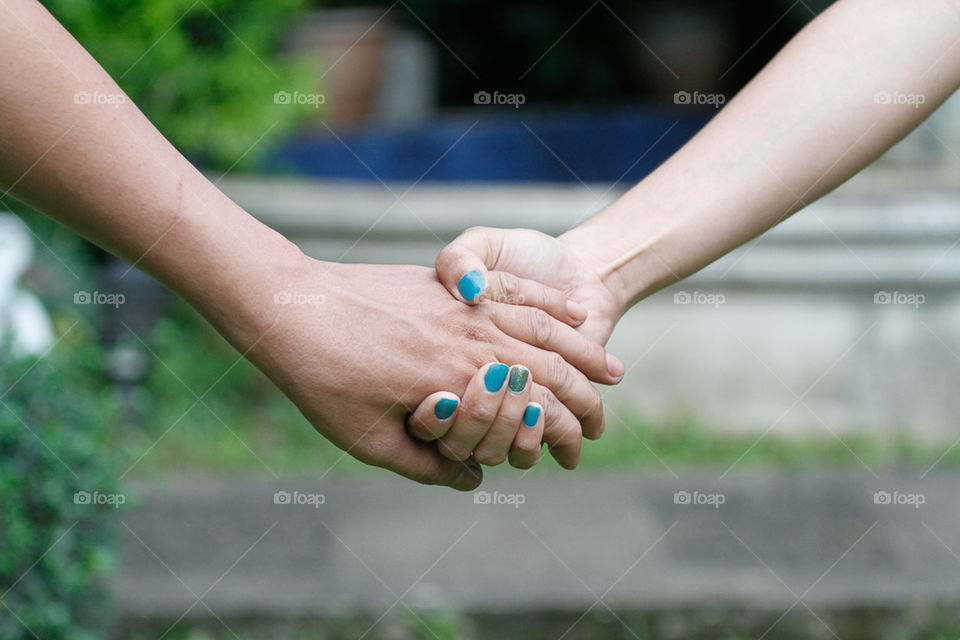 Close-up of holding hands