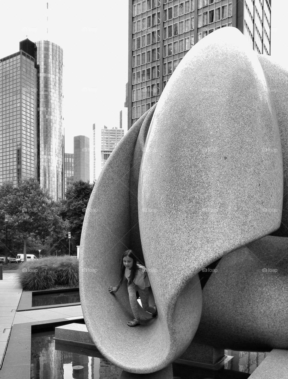 Girl standing inside architectural shape