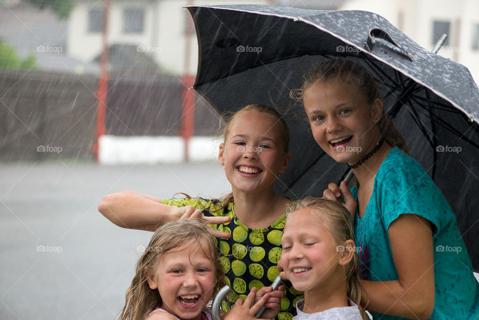 Happy girls in the rain