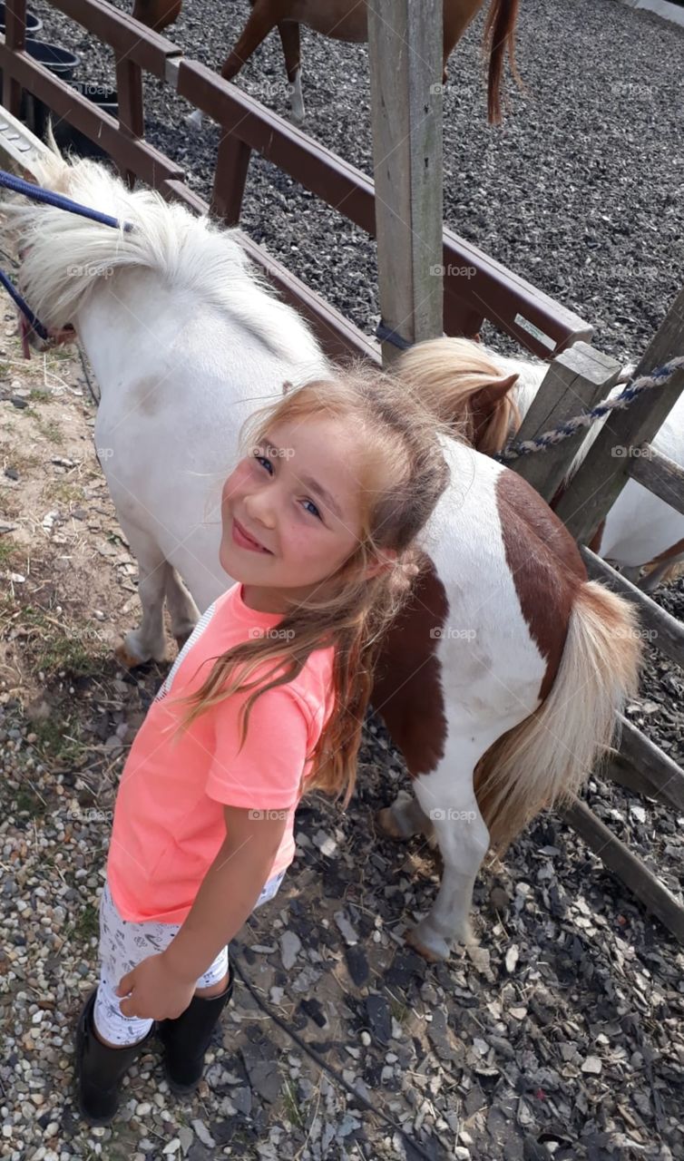 girl having fun with horses