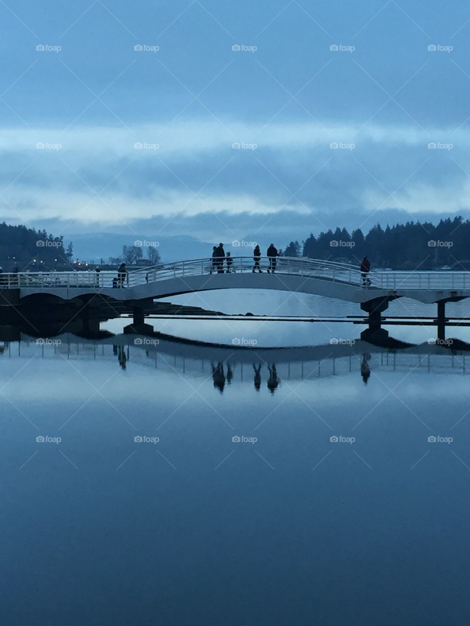 Reflection of a bridge in sea