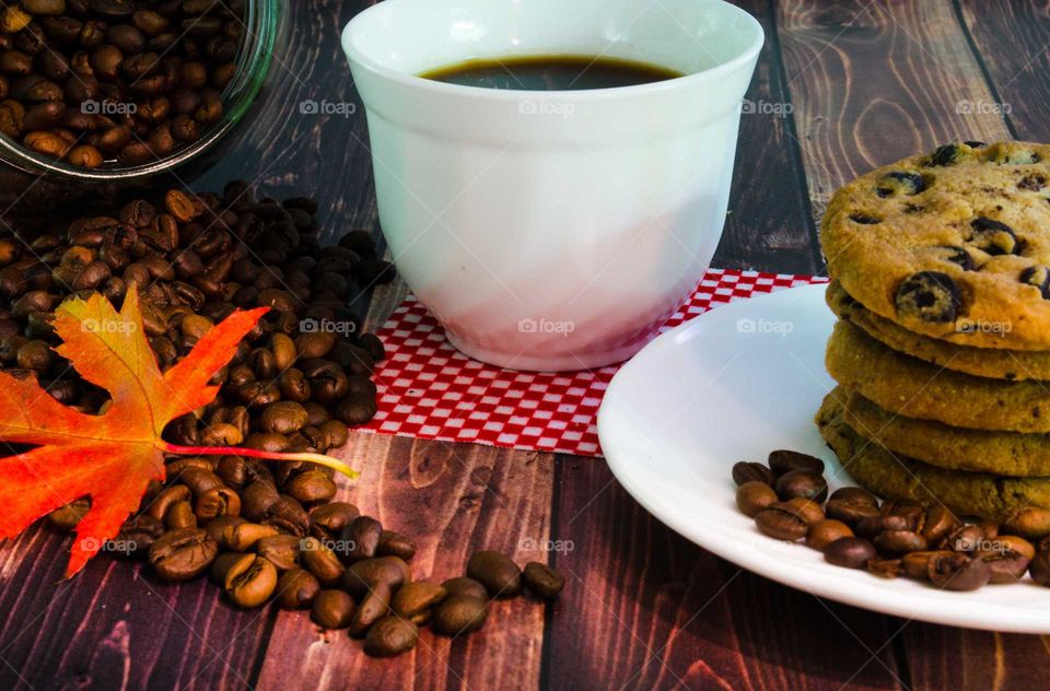 coffee been still life on wooden background