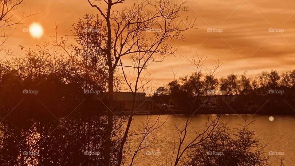 Full coverage from cloud bank leaving the sky totally covered with colorful clouds reflecting from Sky to water. 