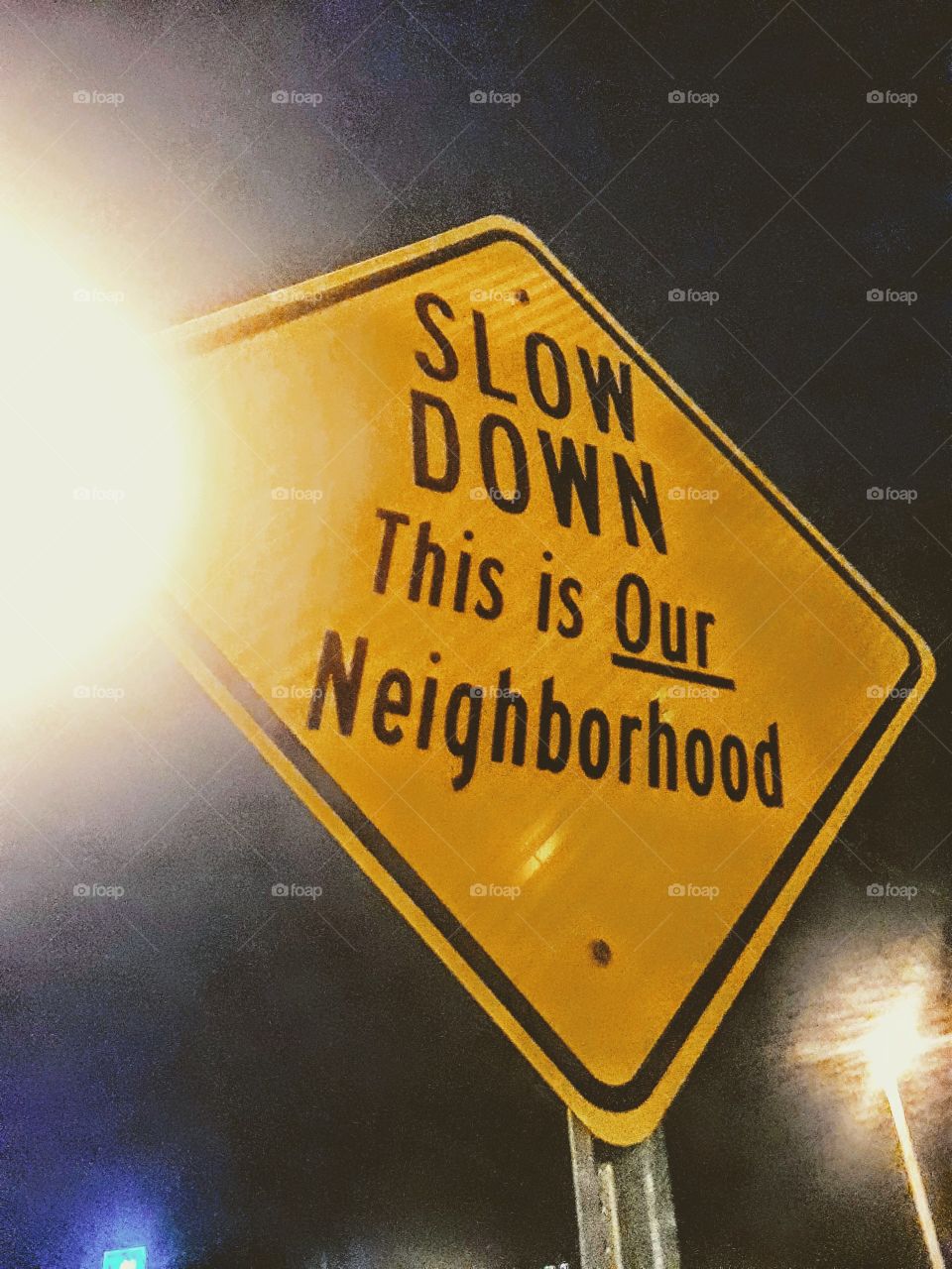 Slow Down neighborhood sign