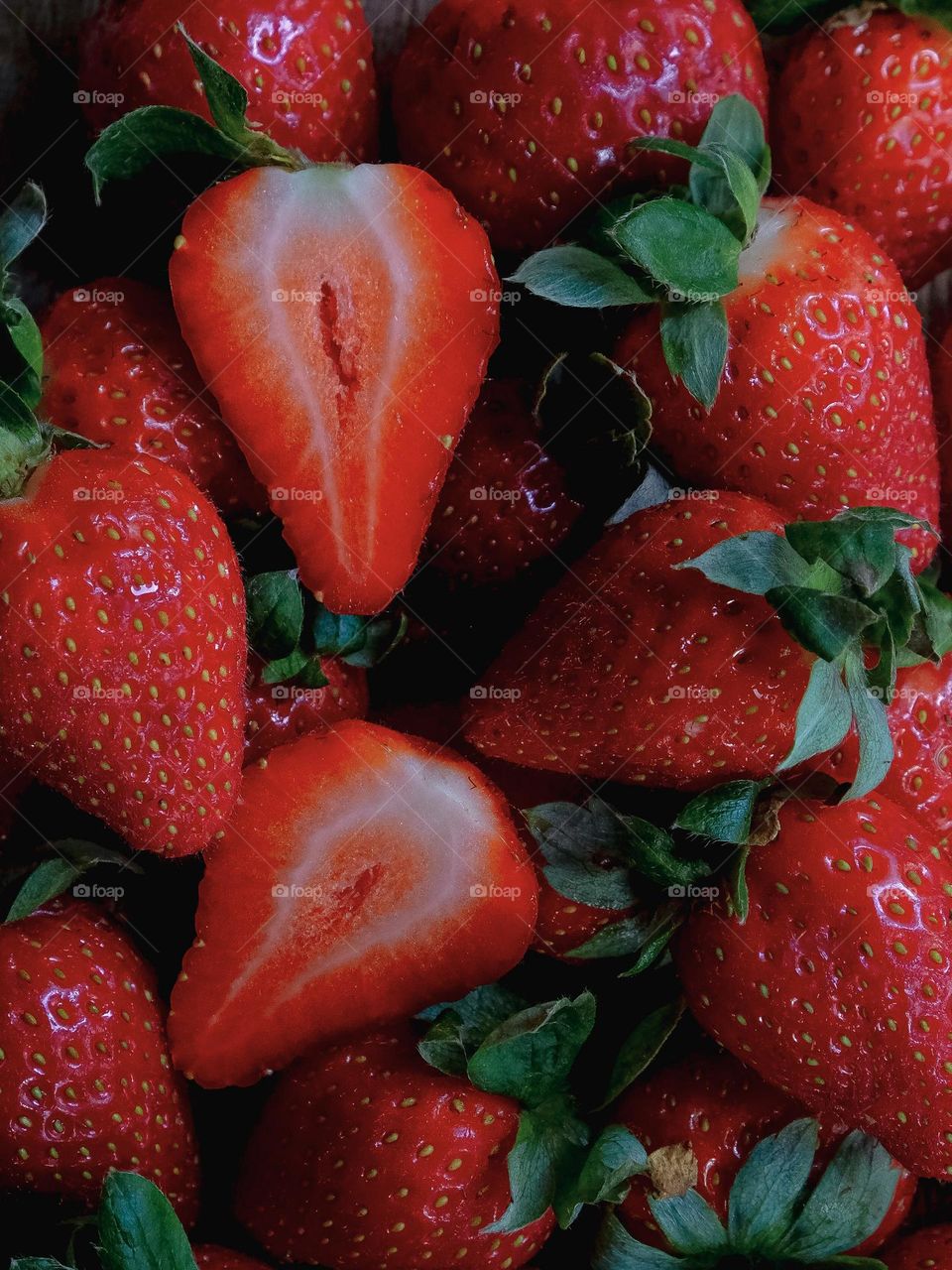 Red ripe strawberries background. Closed up and top view.