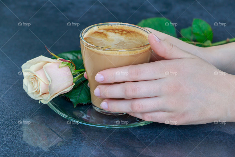 a cup of coffee in hands