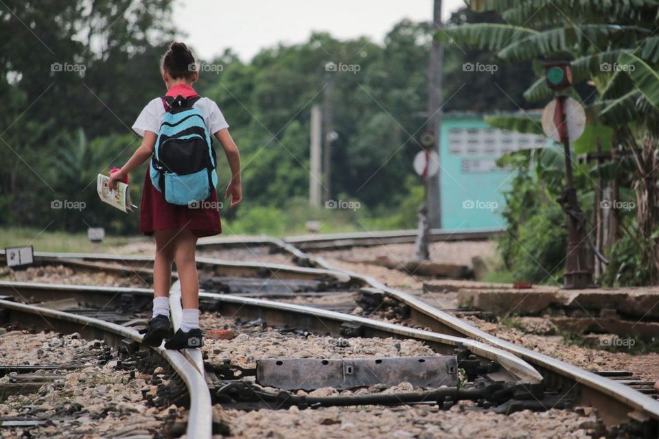 Young School Girl On Her Way To School