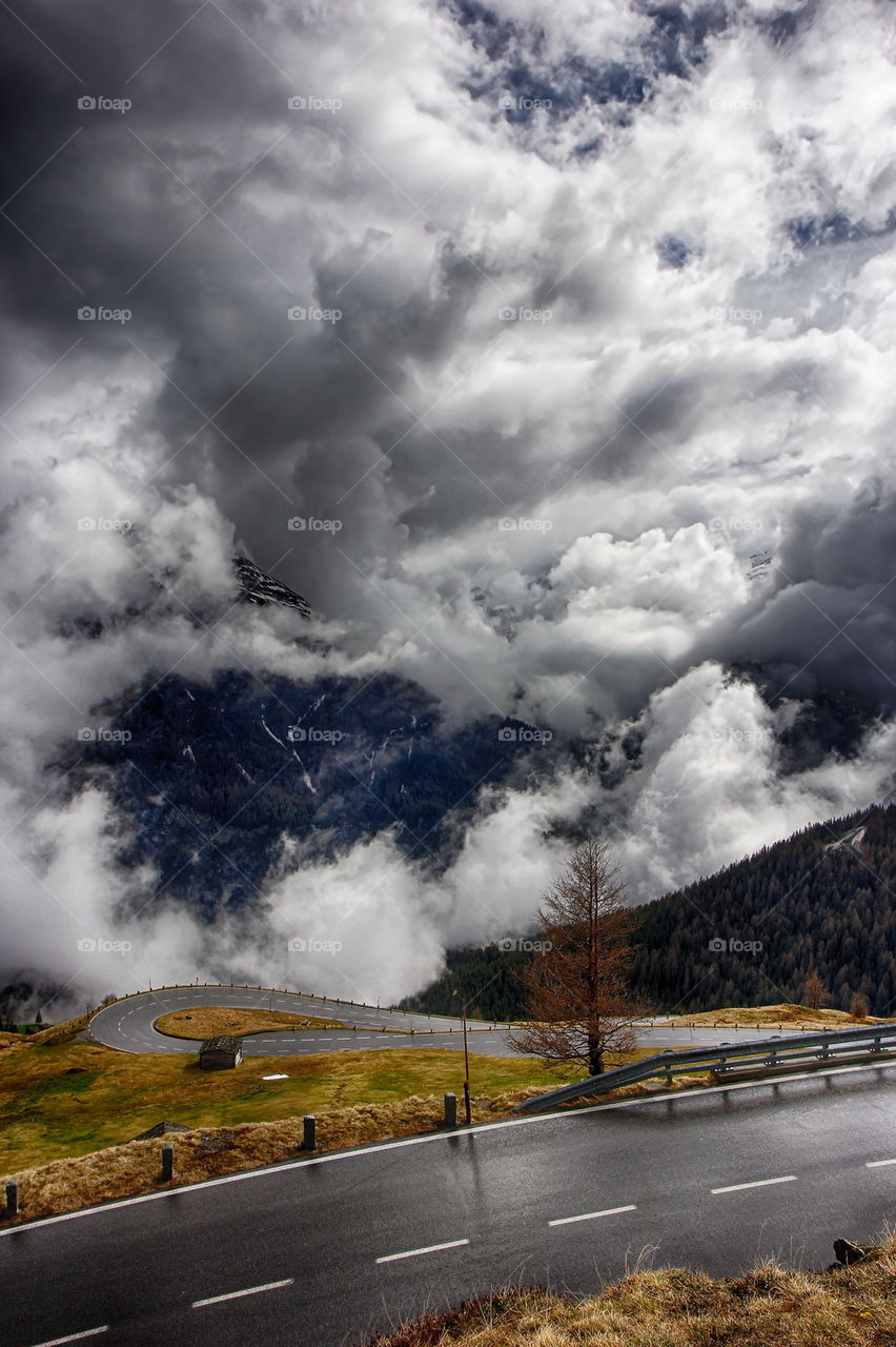 Low angle view of road aganist cloud sky