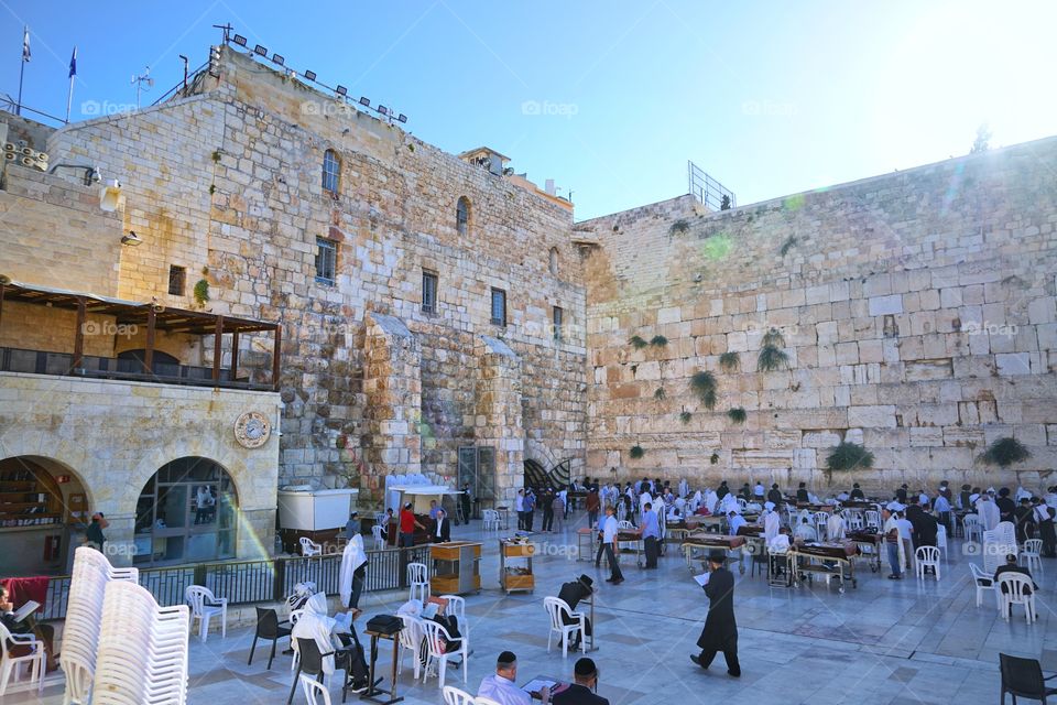 people praying in western wall of jerusalem of Israel