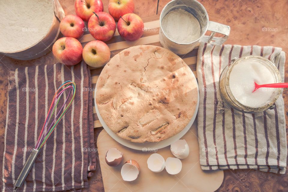 Making homemade puffed apple pie with eggs, sugar and flour.