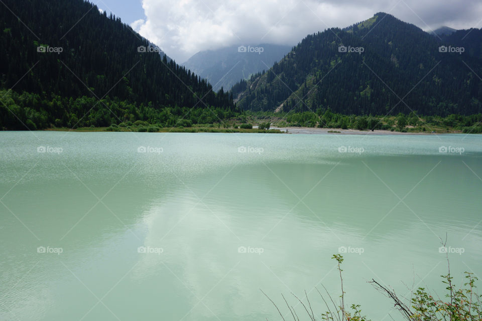 Big Almaty Lake at the Ile-Alatau National Park near Almaty, Kazakhstan on summer afternoon.