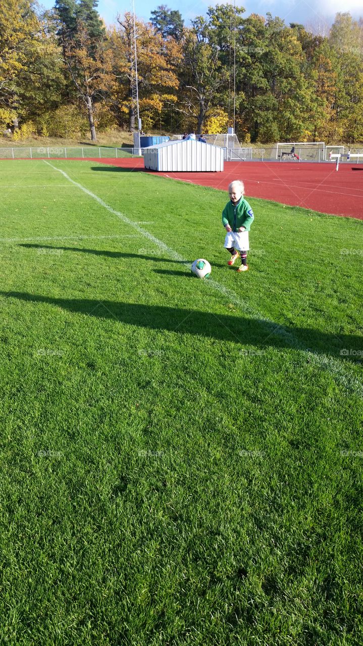 kid playing soccer