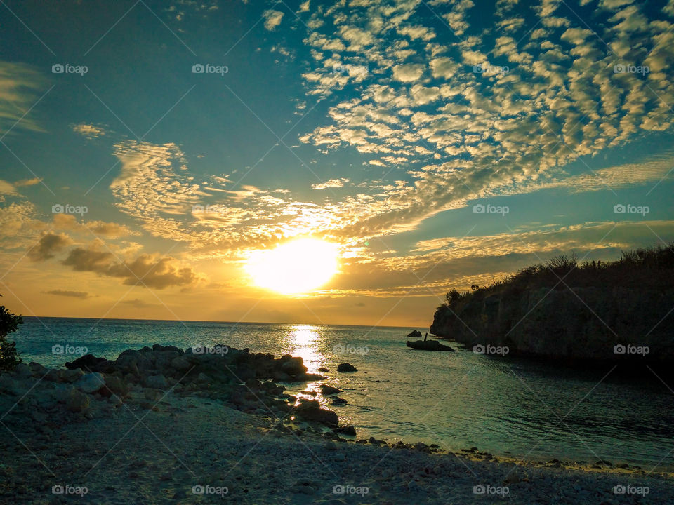 sun setting on the horizon