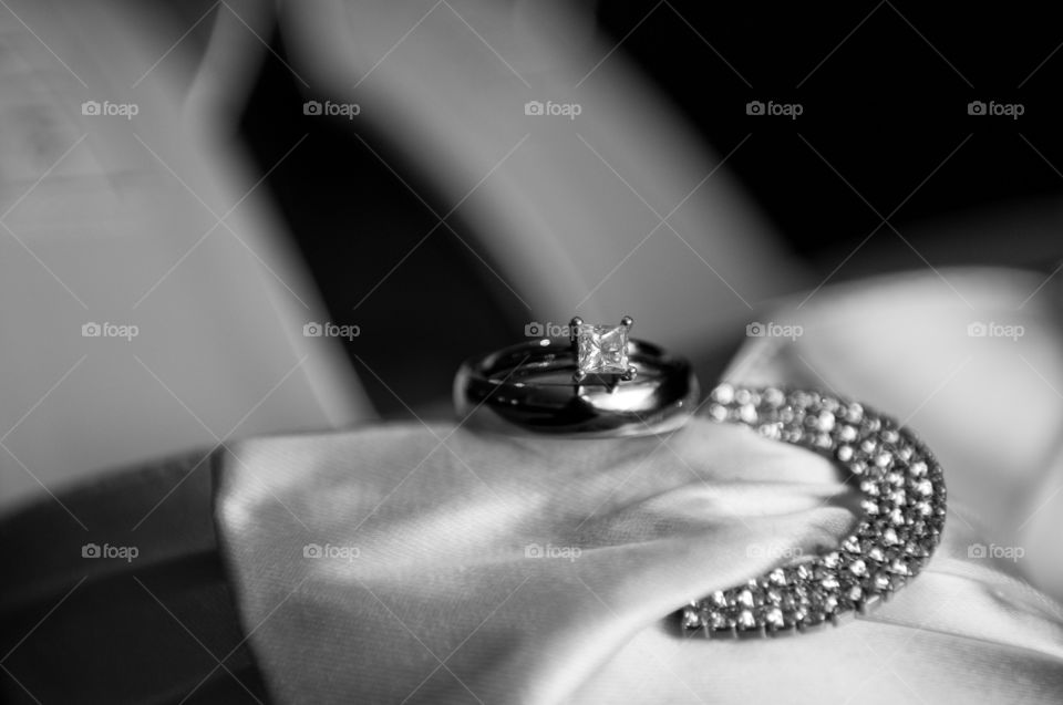 Rings sit gently on the brides shoes before the ceremony.