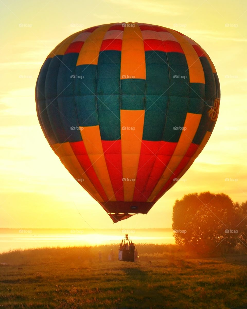 Multicolored air balloon flying