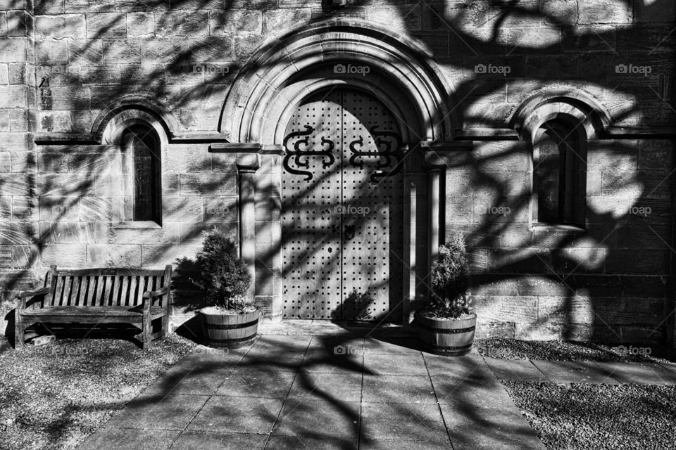 Church door creepy tree shadows