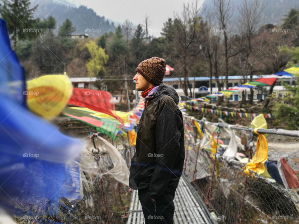 portrait of man on a bridge