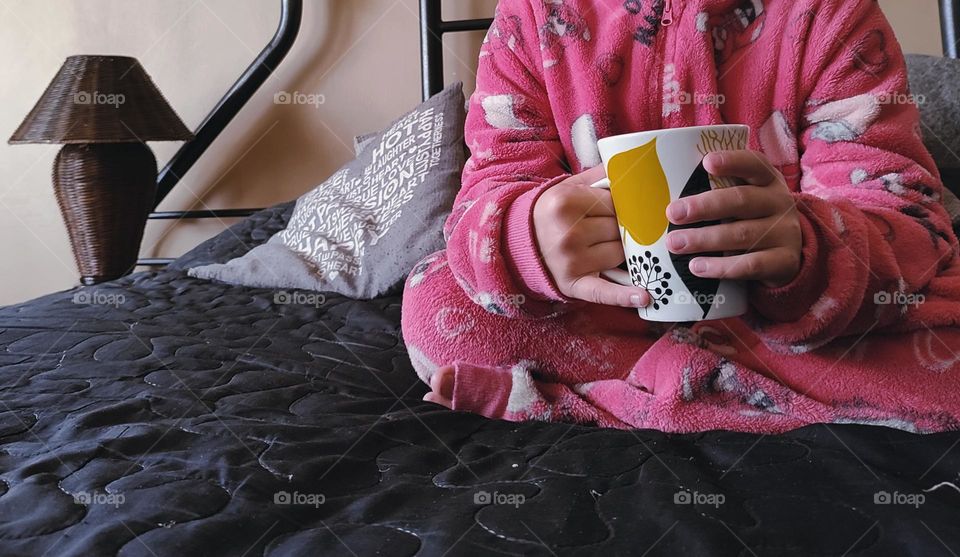 Child sitting on the bed