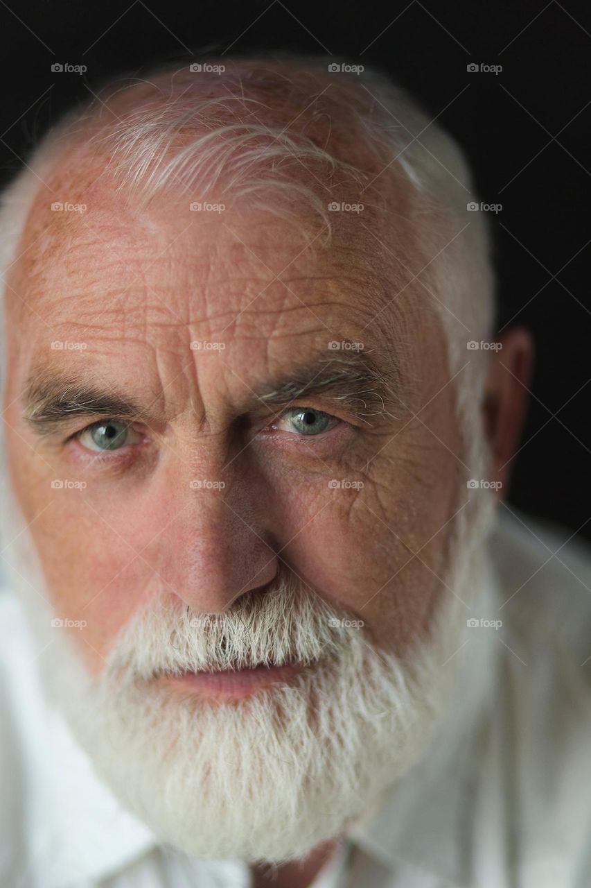 Portrait of an adult, emotions, wrinkles and the history of a person’s life in one portrait. Unique face skin stories