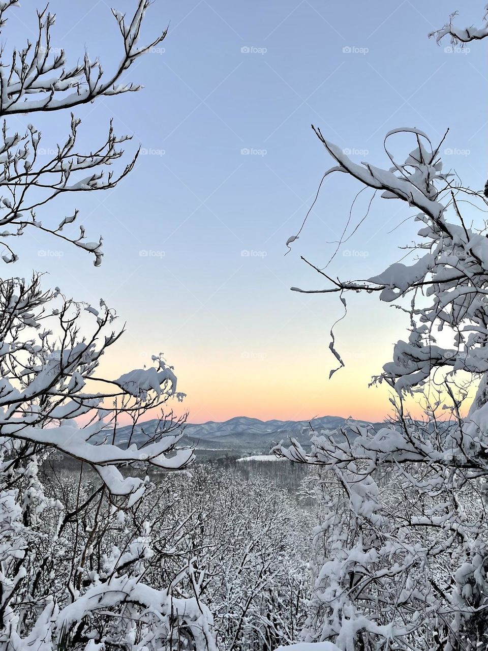 snow covered mountains at sunset