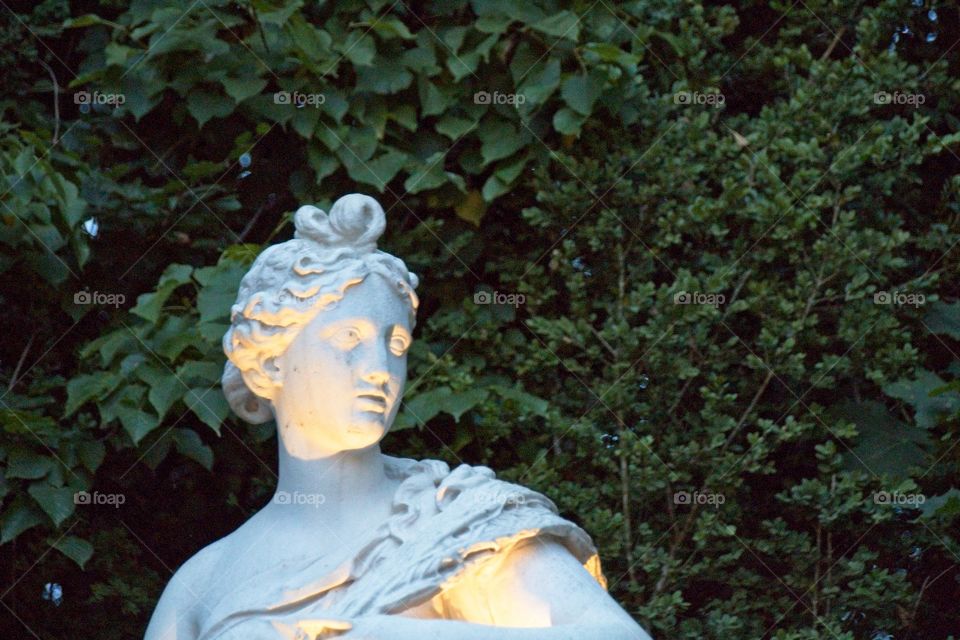 statue of a person in a garden