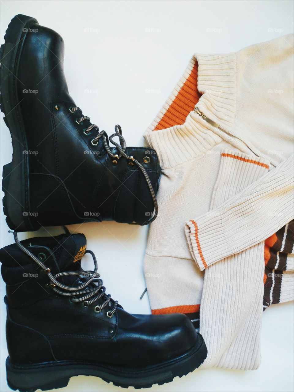 black men's shoes, and white sweater on a white background